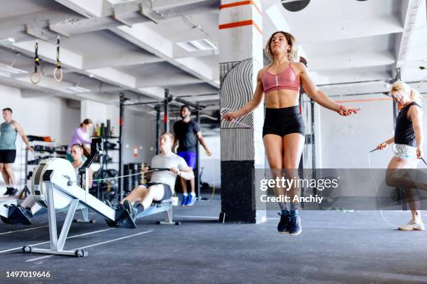 woman jumping rope - rowing machine stock pictures, royalty-free photos & images