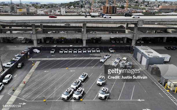 In an aerial view, Waymo autonomous vehicles sit parked in a staging area on June 08, 2023 in San Francisco, California. Autonomous vehicle companies...