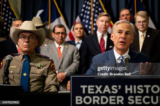 Texas Gov. Greg Abbott speaks as Texas Department of Public Safety Director Steve McCraw and elected officials look on at a news conference at the...