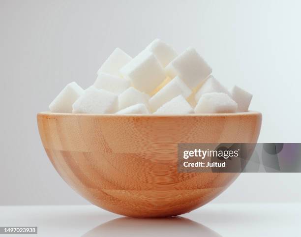 wooden bowl with white sugar cubes - azucar stock pictures, royalty-free photos & images