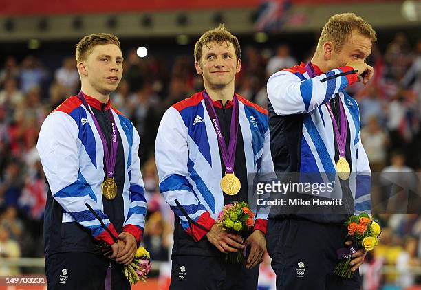 Philip Hindes, Jason Kenny and Sir Chris Hoy of Great Britain celebrate with their gold medals during the medal ceremony after setting a new world...