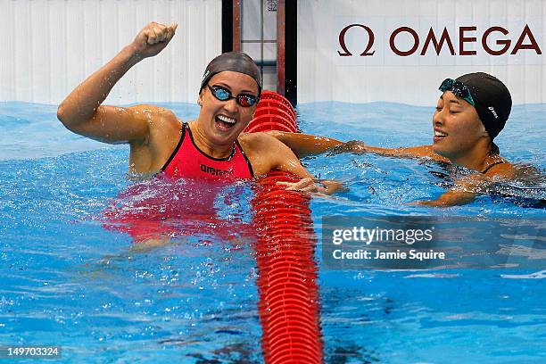 Rebecca Soni of the United States celebrates after winning gold and setting a new world record time of 2:19.59 in the Women's 200m Breaststroke Final...