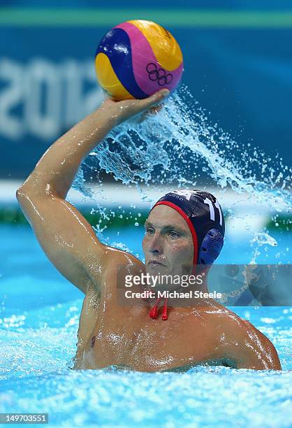 Jesse Smith of the United States competes during the Men's Water Polo Preliminary Round match between Great Britain and the United States at the...