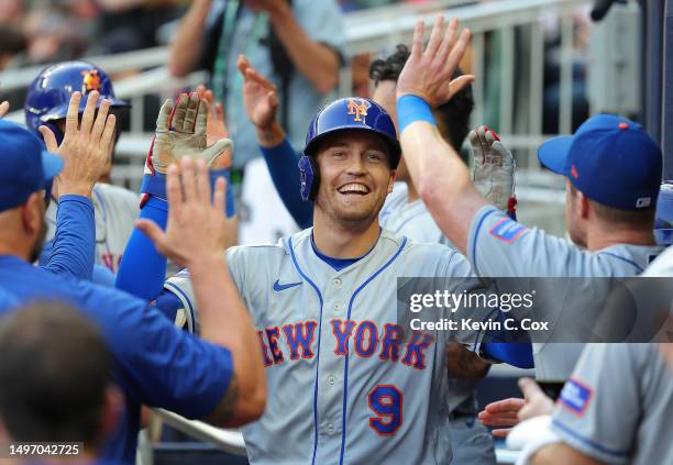 Brandon Nimmo of the New York Mets reacts after hitting a grand slam in the first inning against the Atlanta Braves at Truist Park on June 08, 2023...