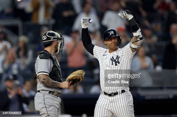 Gleyber Torres of the New York Yankees celebrates his two run home run in the fourth inning as Yasmani Grandal of the Chicago White Sox reacts during...