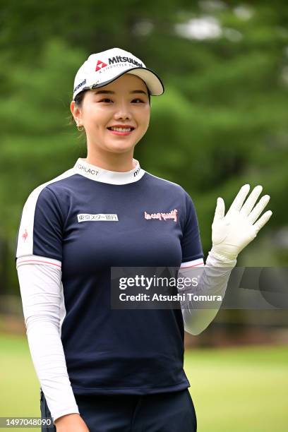 Yuting Seki of China waves on the 12th green during the second round of Ai Miyazato Suntory Ladies Open Golf Tournament at Rokko Kukusai Golf Club on...