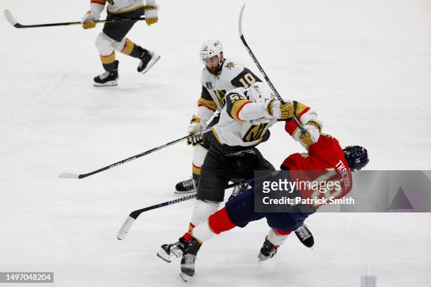 Matthew Tkachuk of the Florida Panthers is checked by Keegan Kolesar of the Vegas Golden Knights during the first period in Game Three of the 2023...