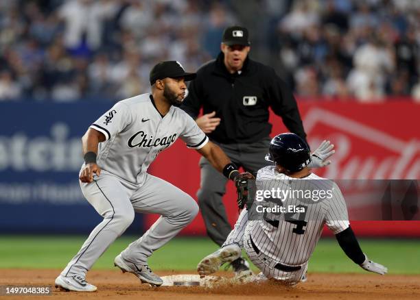 Elvis Andrus of the Chicago White Sox tries to tag out Willie Calhoun of the New York Yankees in the fourth inning during game two of a double header...