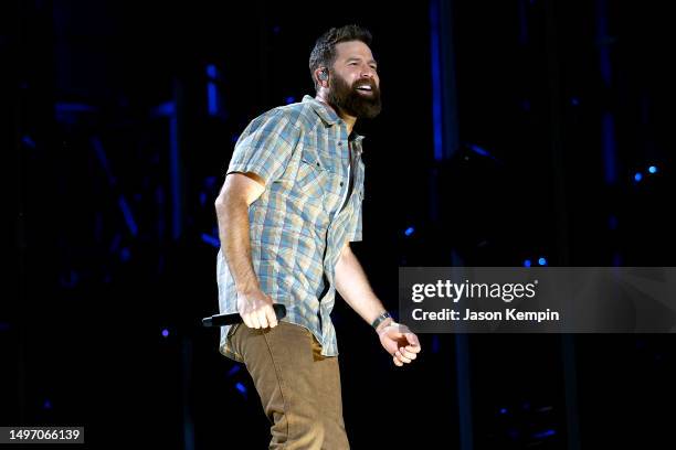 Jordan Davis performs on stage during day one of CMA Fest 2023 at Nissan Stadium on June 08, 2023 in Nashville, Tennessee.