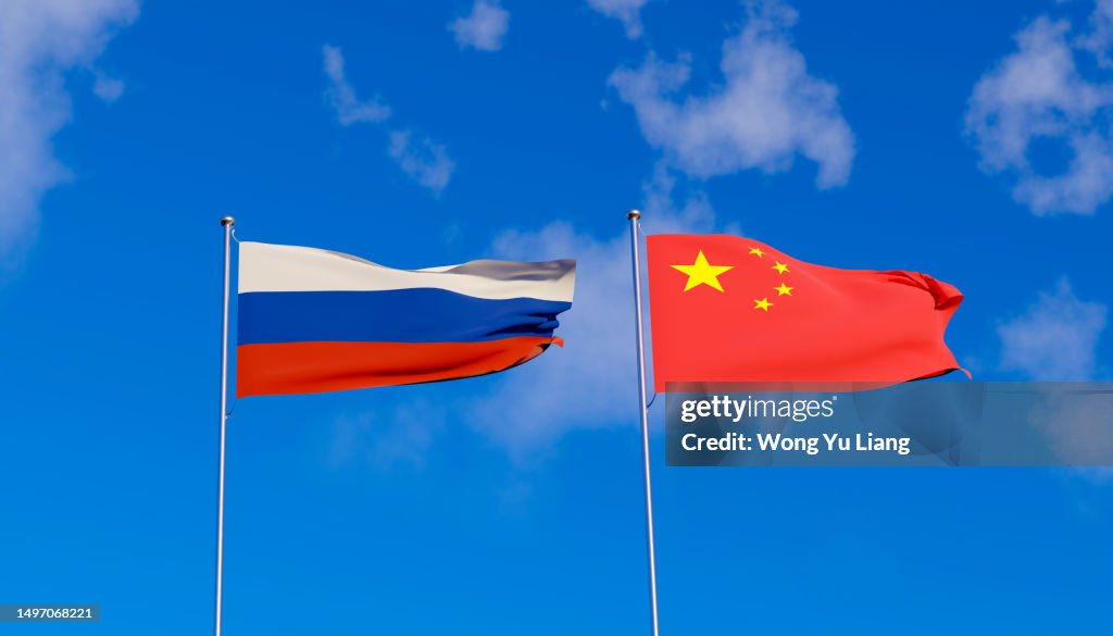 Russia China flag with blue sky background