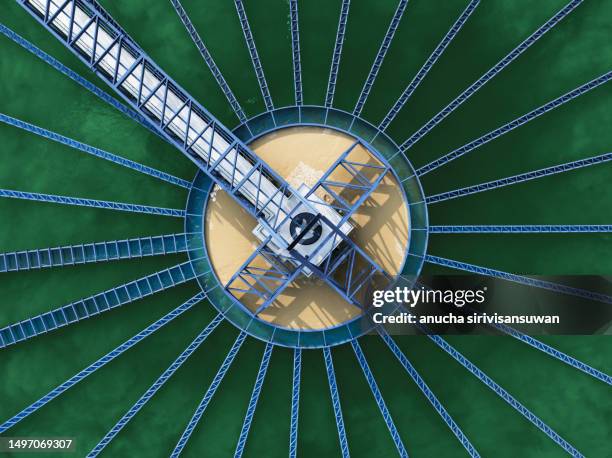 aerial view sewage treatment plant near downtown. - ralo estrutura construída - fotografias e filmes do acervo