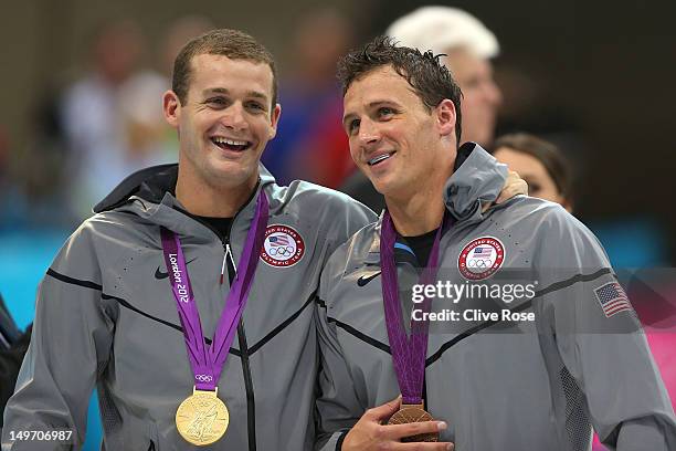 Gold medallist Tyler Clary of the United States celebrates with bronze medallist Ryan Lochte of the United States following the medal ceremony for...