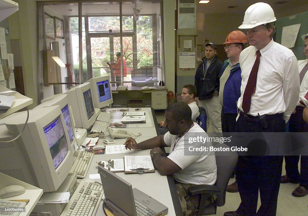 Mwra Executive Director of the MWRA Fred Laskey watches as James Polk ...