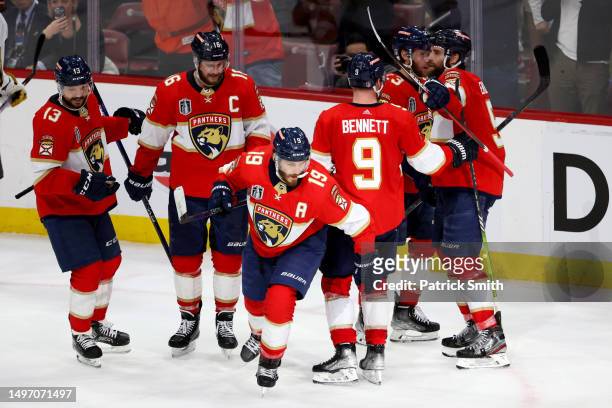 Matthew Tkachuk of the Florida Panthers is congratulated by his teammates after scoring a goal against the Vegas Golden Knights during the third...