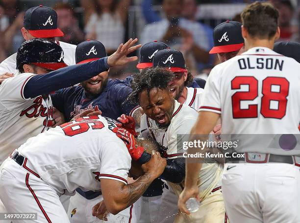 Ozzie Albies of the Atlanta Braves celebrates after hitting a three-run walk-off homer in the 10th inning against the New York Mets at Truist Park on...