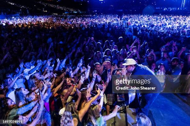 Luke Combs performs onstage during night 1 of the 50th CMA Fest at Nissan Stadium on June 08, 2023 in Nashville, Tennessee.