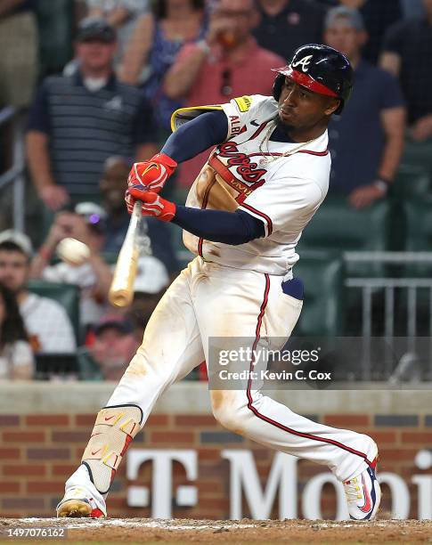 Ozzie Albies of the Atlanta Braves hits a three-run walk-off homer in the 10th inning against the New York Mets at Truist Park on June 08, 2023 in...