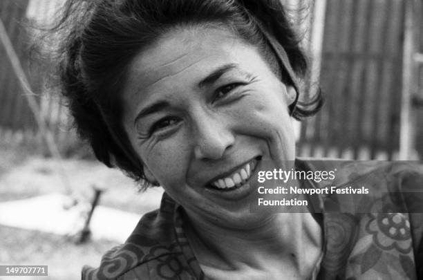 Toshi Seeger, wife and partner of folk singer Pete Seeger, mother, and activist, poses for a portrait at the Newport Folk Festival in July 1963 in...