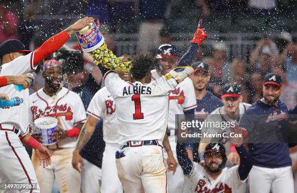 Ozzie Albies of the Atlanta Braves reacts after hitting a three-run walk-off homer in the 10th inning against the New York Mets at Truist Park on...