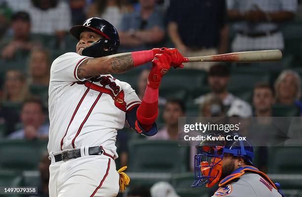 Orlando Arcia of the Atlanta Braves hits a game-tying solo homer in the ninth inning against the New York Mets at Truist Park on June 08, 2023 in...