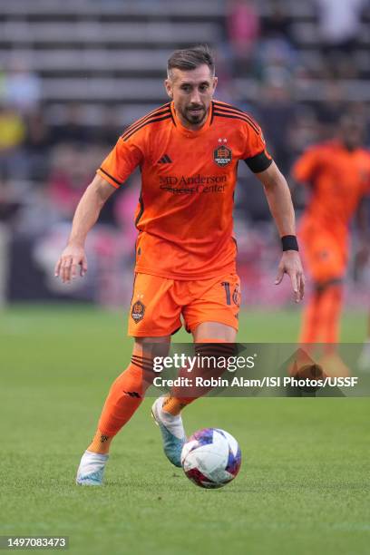 Héctor Herrera of Houston Dynamo dribbles the ball at SeatGeek Stadium on June 6, 2023 in Bridgeview, Illinois.