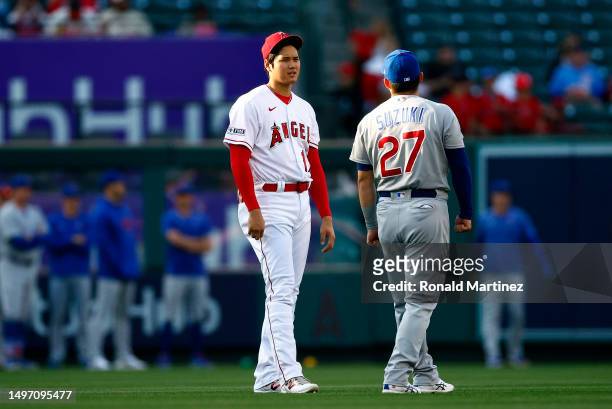 Shohei Ohtani of the Los Angeles Angels and Seiya Suzuki of the Chicago Cubs before a game at Angel Stadium of Anaheim on June 08, 2023 in Anaheim,...