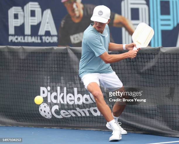 Hayden Patriquine hits a backhand slice return against Ben Newell during the PPA Pro Men's Singles division at Life Time Rancho San Clemente on June...