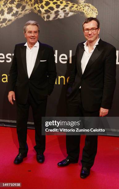 Alain Delon and Olivier Pere attends the Life Achievement Award red carpet during the 65th Locarno Film Festival on August 2, 2012 in Locarno,...