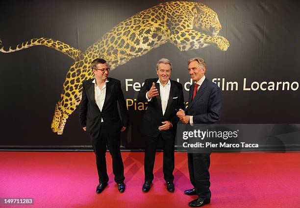 Olivier Pere, Alain Delon and Marco Solari attend the Life Achievement Awards red carpet on August 2, 2012 in Locarno, Switzerland.