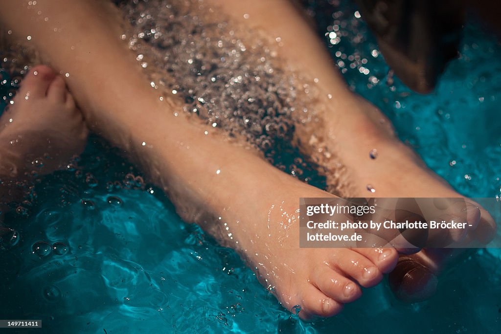 Paddling pool with childs feet