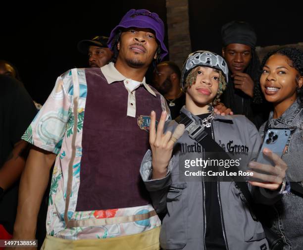 Rapper T.I. And Rapper King Harris attend Trapper Of The Year Future Art Unveiling at Trap Music Museum on June 08, 2023 in Atlanta, Georgia.