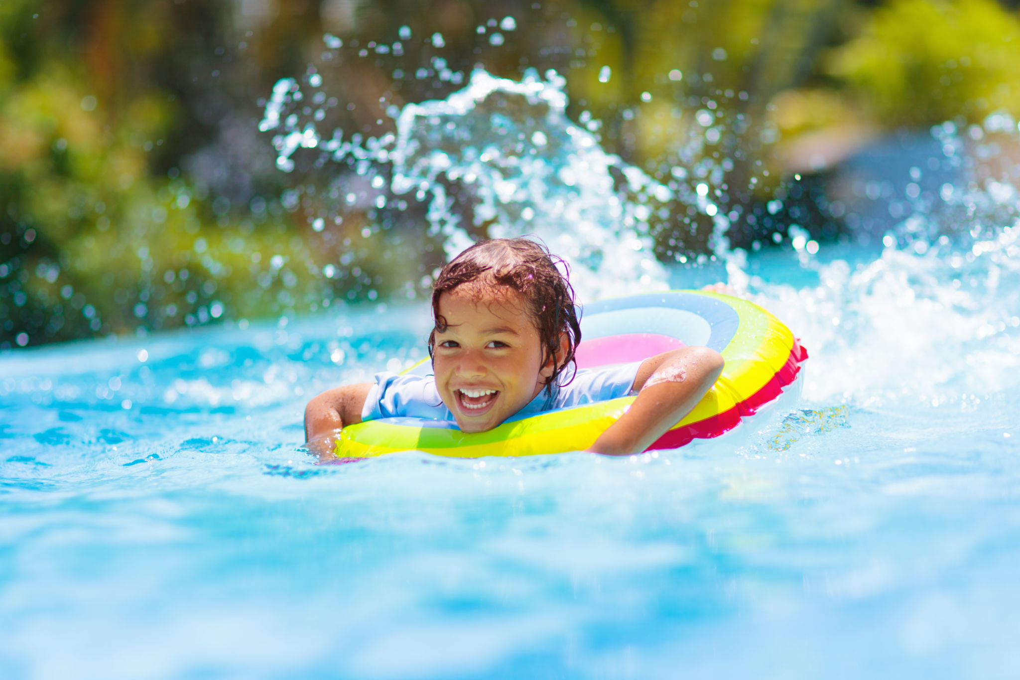 Child in swimming pool on toy ring. Kids swim. Child in swimming pool on toy ring. Kids swim.