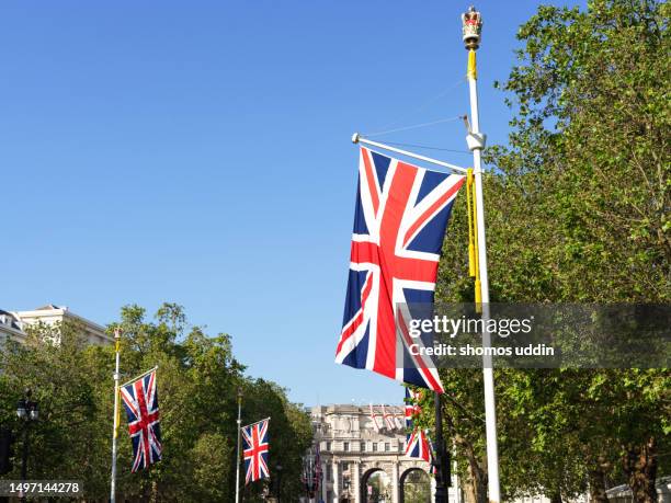 british flag on a bright sunny day - union jack background stock pictures, royalty-free photos & images