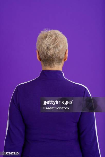 turning her back on them - tracksuit stock pictures, royalty-free photos & images