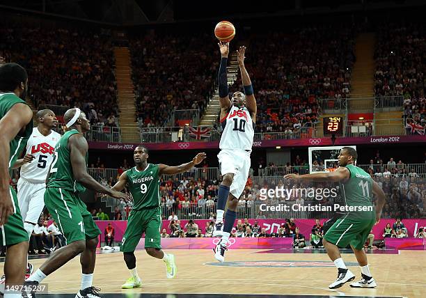 Kobe Bryant of United States shoots Chamberlain Oguchi of Nigeria in the first half during the Men's Basketball Preliminary Round match on Day 6 of...