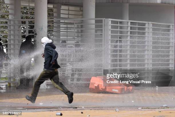 Colombia's riot police clash with demonstrators at Bogota's 'Universidad Nacional' during the day of the fallen student, june 8, 2023. Clashes...