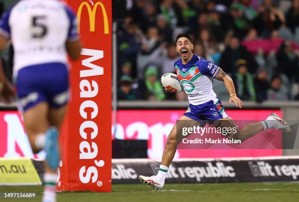 Shaun Johnson of the Warriors celebrates an intercept try during the round 15 NRL match between Canberra Raiders and New Zealand Warriors at GIO...