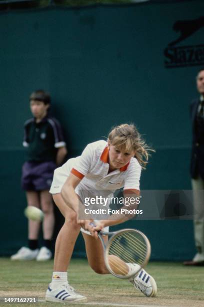 American teenage tennis player Kathy Rinaldi plays a backhand during the Women's Singles tournament at Wimbledon, All England Lawn Tennis Club,...