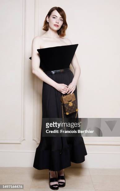 Emma Stone poses during a portrait session as she attends a Louis Vuitton private dinner at the Hotel Ritz on June 08, 2023 in Paris, France.