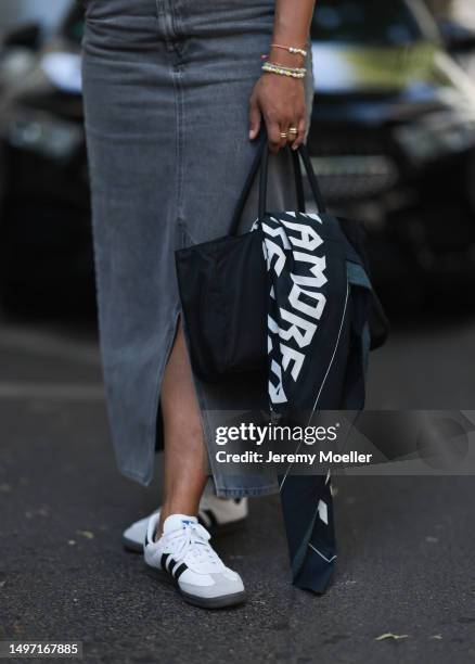 Jennifer Suhr seen wearing Prada Re Nylon black handbag, Monki grey denim long jeans skirt, Black White Grey oversized white Shirt, LENIKA x Black...