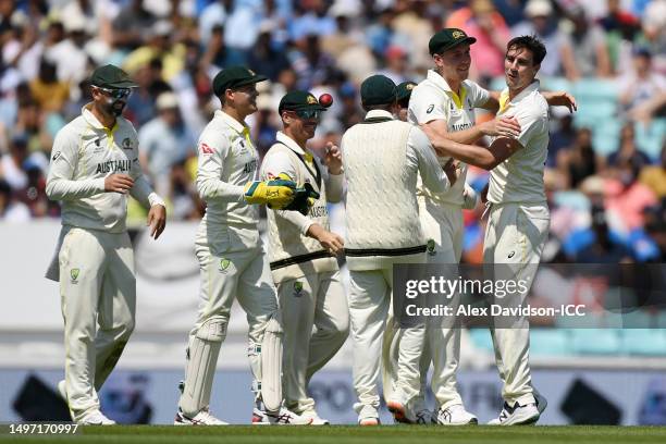 Cameron Green of Australia celebrates catching out Ajinkya Rahane of India with bowler Pat Cummins during day three of the ICC World Test...