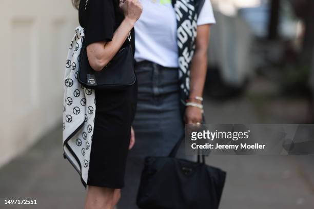 Helen Unsinn seen wearing black and white stripped Givenchy sandals, black Prada handbag, Yves Saint Laurent black shades, Lenika white and black...