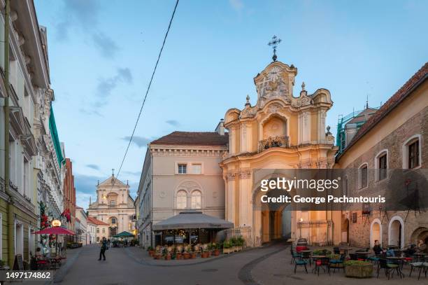 the basilian gate in the old town of vilnius, lithuania - vilnius street stock pictures, royalty-free photos & images