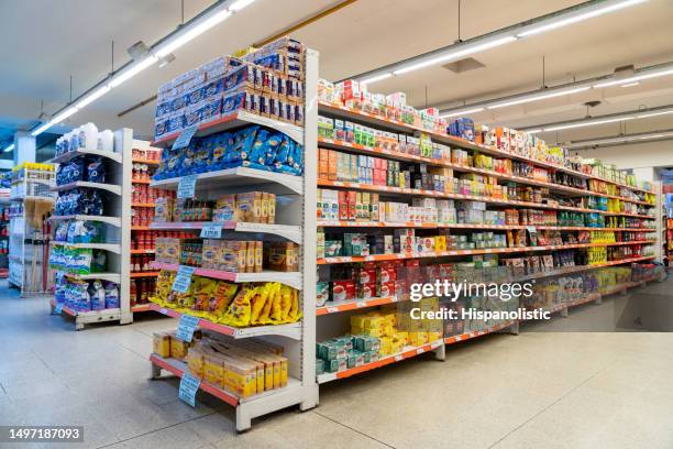 variety of products on the different aisles and shelfs at the supermarket - stormarknad bildbanksfoton och bilder