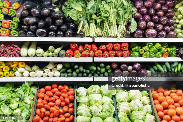 variety of fresh vegetables in the refrigerated section of the supermarket - multi coloured choice stock pictures, royalty-free photos & images