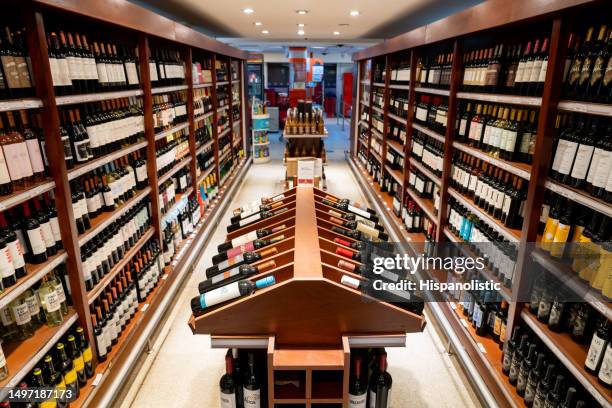 alcohol aisle at the supermarket - argentina wine stock pictures, royalty-free photos & images