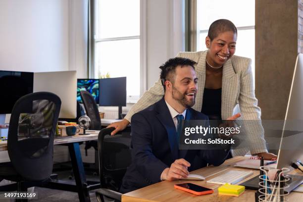 working together promotes growth - down syndrome office stock pictures, royalty-free photos & images
