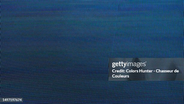 very close-up shot of an advertising screen lit by blue leds in times square, new york, united states - led light stock pictures, royalty-free photos & images