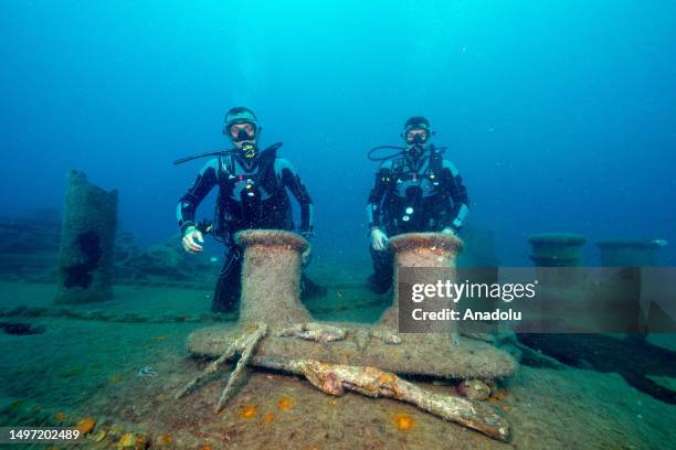 Divers poses for a photo on the shipwreck of French Navy's Society at the bottom of sea in Antalya, Turkiye on June 16, 2023. The shipwreck is filmed...