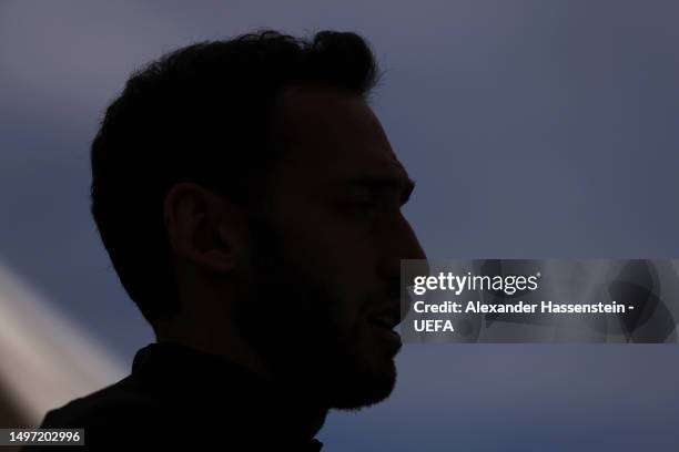 Silhouette of Hakan Calhanoglu of FC Internazionale as they speak to the media prior to the FC Internazionale Training Session ahead of UEFA...